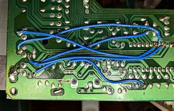 Technician inspecting electrical panel in Dubai